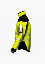 Laden Sie das Bild in den Galerie-Viewer, •	Atmungsaktive Softshelljacke mit Polarfleece und hochabschließendem Kragen, Unterarmbelüftung, abriebfeste Verstärkungen an Schultern und Ellenbogen, Kapuze mit seitlichen Sichtfenstern (Ansicht links)Hier ist eine Softshelljacke abgebildet, die winddicht und wasserabweisend ist. Eine durchdachte Taschenplatzierung ermöglicht das Tragen der Jacke im Klettergurt beim Industrieklettern in der Höhe (Ansicht links)
